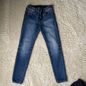 Buckle black high rise skinny jeans